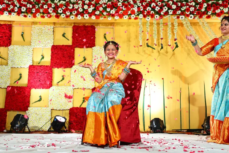 A reception stage, the couple on it.
