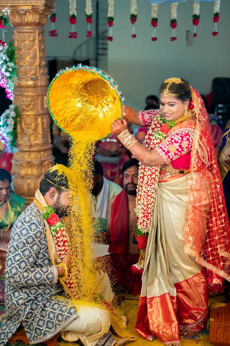Album page: golden rice pouring over the bride's head
